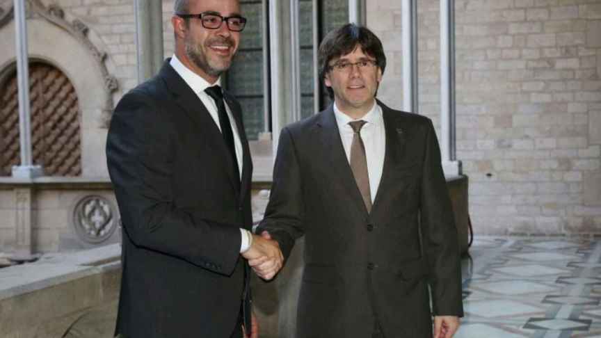 Miquel Buch y el ex presidente Puigdemont.